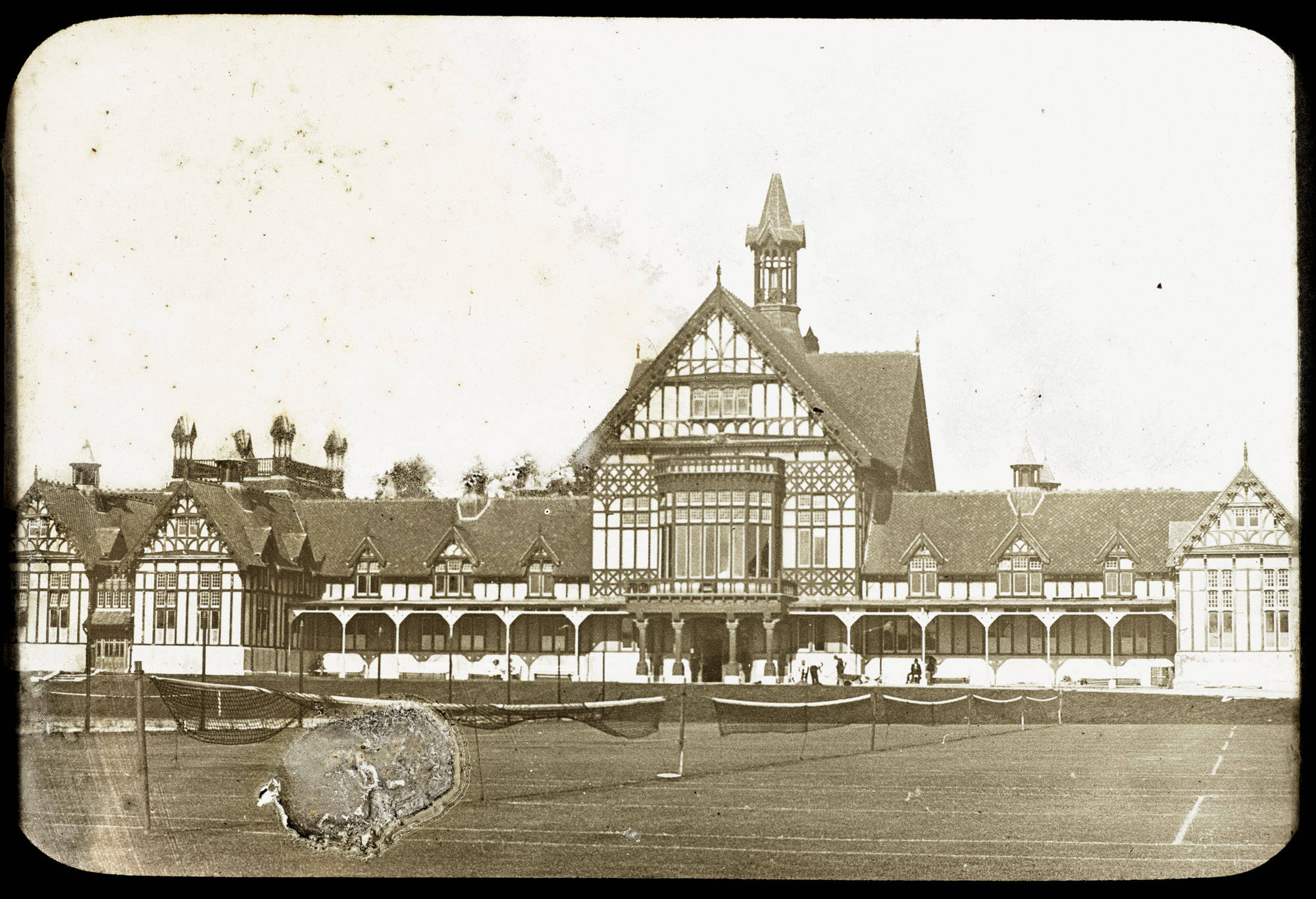The Tudor-style Bath House about 1910, with tennis nets on the lawns in front