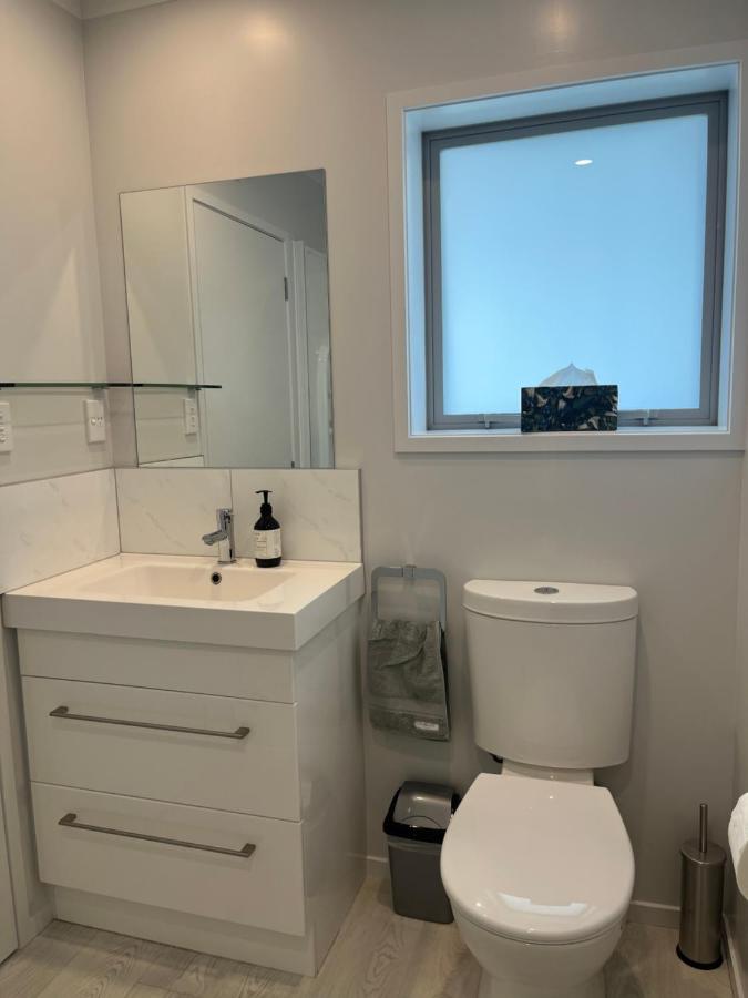 The modern private bathroom with vanity and walk-in shower
