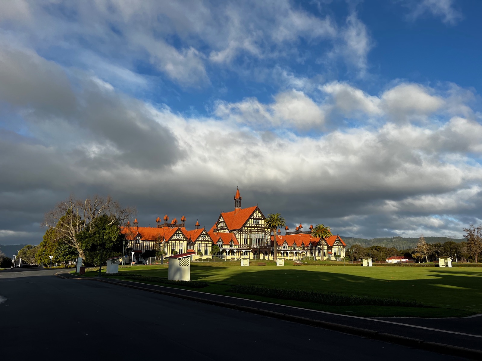 The Bath House today across the Government Gardens lawn under a dramatic sky