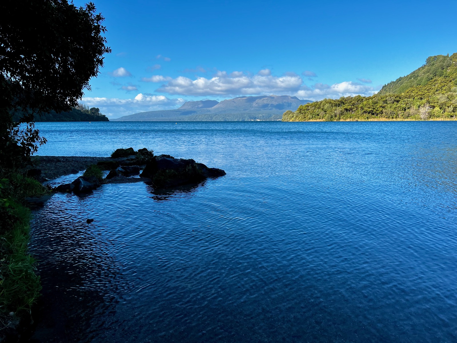 Mount Tarawera today, seen across the blue water of Lake Tarawera from the lookout road