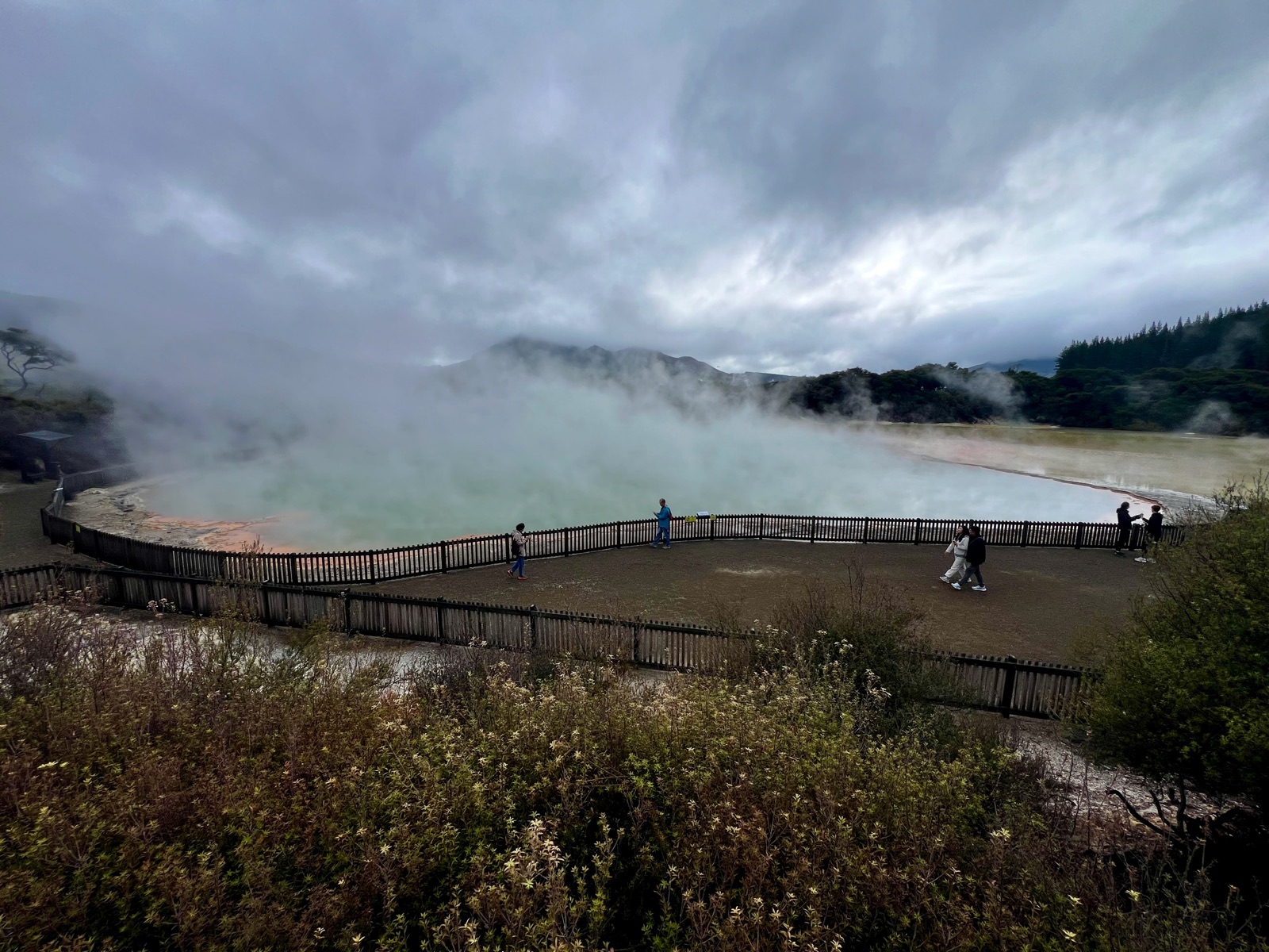 Steam drifting over the orange rim of the Champagne Pool